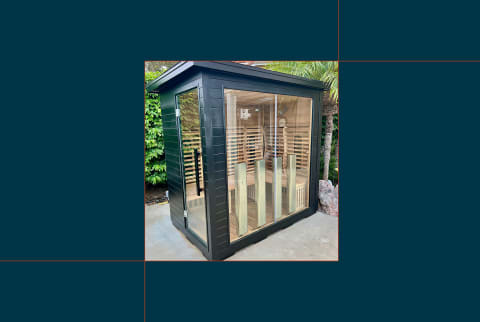 photo of sun home luminar sauna set up outside tester's house on blue background photo of sun home luminar sauna set up outside tester's house on blue background