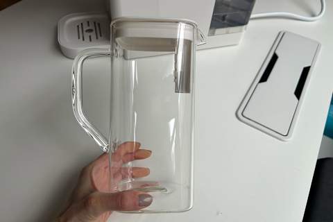 sans water purifier pitcher in writer's hand